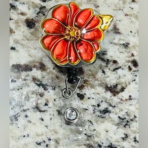 Flower badge reel. Badge pull.